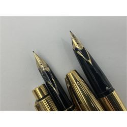 Sheaffer Triumph Imperial fountain pen, the gold plated barrel with fluted stripe design and gold nib stamped 14K 585, together with a Sheaffer Targa slimline fountain pen with gold plated barrel similarly decorated with gold nib stamped 14K 585, ballpoint pen and propelling pencil, each with a fluted gold plated barrel, largest L13.5cm (4)