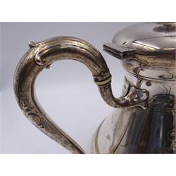 French silver coffee pot, of tapering bellied form, with engraved foliate and scrolling decoration and monogram to body, with C scroll handle with ivory insulators, upon four openwork palm leaf pad feet, Minerva's head for 800 standard and weevil import mark, H22cm This item has been registered for sale under Section 10 of the APHA Ivory Act