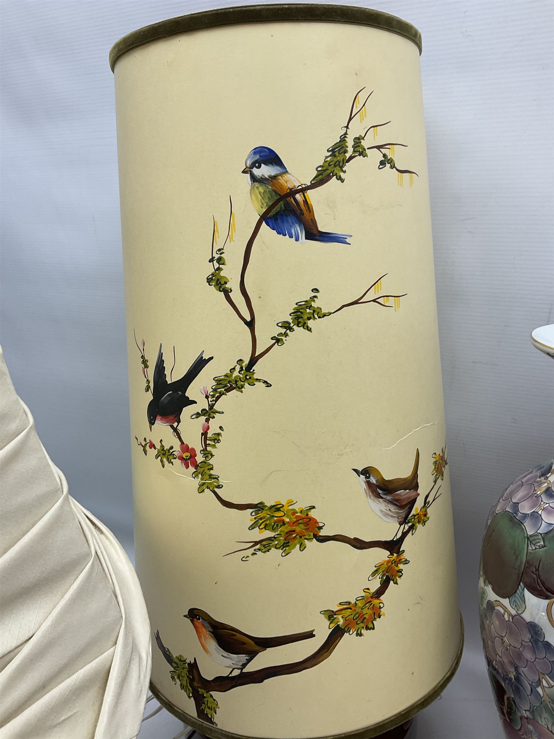 Collection of table lamps to include one of baluster form, decorated with fruit, one of squat, with a hand painted lampshade, and two standard lamps