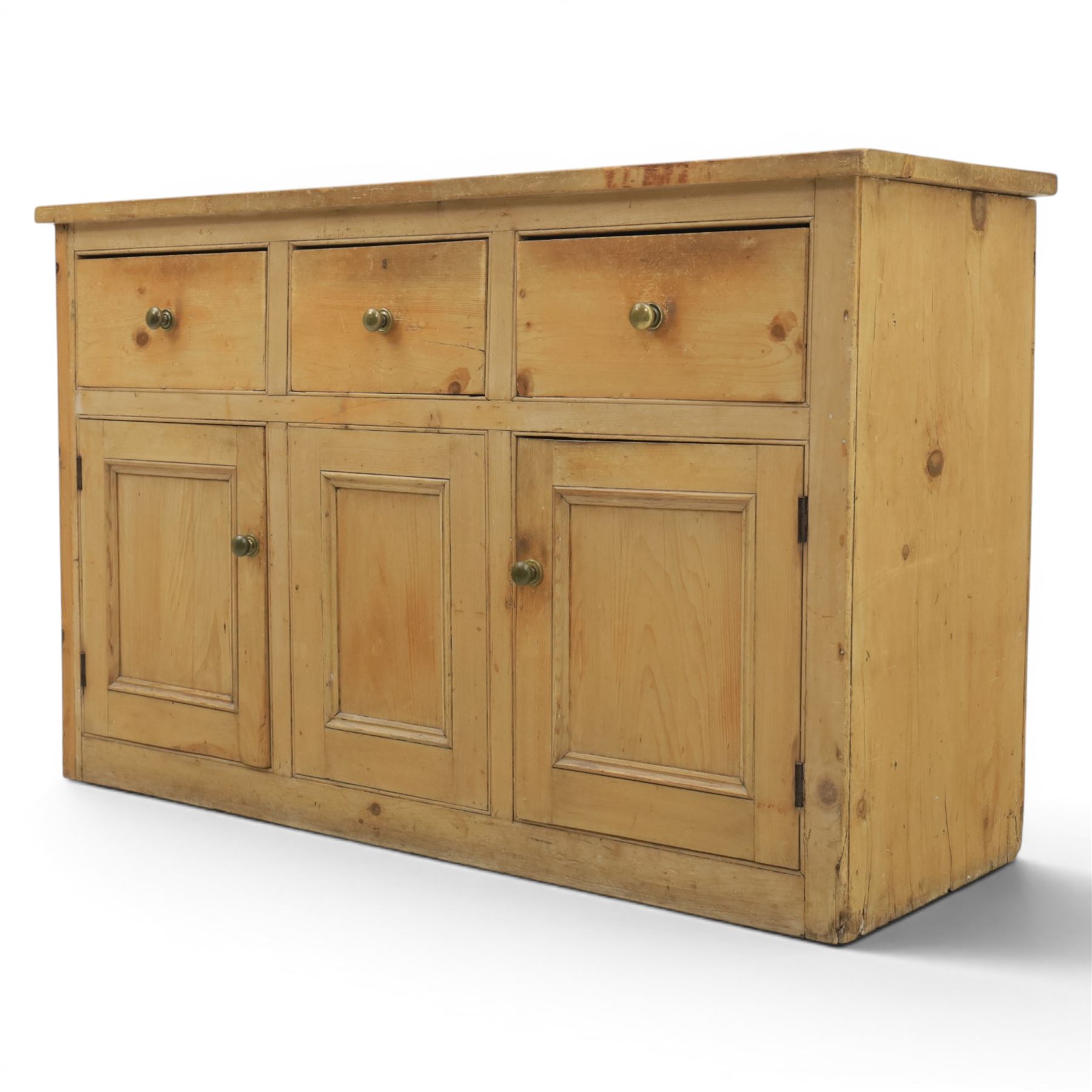 Victorian pine dresser base, with rectangular plank top, above three short drawers over two cupboard doors