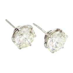 Pair of platinum round brilliant cut diamond stud earrings, Birmingham 1981, total diamond weight 5.00 carat, VS1-VS2 clarity, colour K, with World Gemological Institute certificate