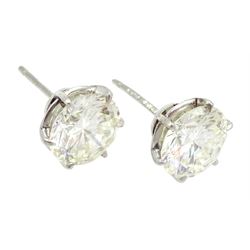 Pair of platinum round brilliant cut diamond stud earrings, Birmingham 1981, total diamond weight 5.00 carat, VS1-VS2 clarity, colour K, with World Gemological Institute certificate