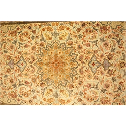 Quoom silk rug, the rectangular field with circular motif on an ivory ground surrounded by floral tendrils and shaped spandrels, within multiple borders incorporating a small scripted panel, in mauve, pale blue, black, ivory, red pink, browns and ochre, W97cm L156cm Provenance: This lot was gifted to the vendor who worked for the Royal Family of Oman  