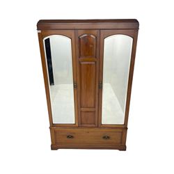 Edwardian walnut double wardrobe, fitted with two bevelled mirror panelled doors, single drawer to base