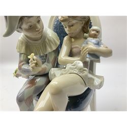Lladro figure, Flirtatious Jester, modelled as a jester and girl sat on a chair, with original box, no 5844, year issued 1994, year retired 1997, H26cm
