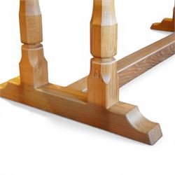 Knightman - oak rectangular refectory four pillar dining table, rectangular plank top, over twin pillar supports to both ends, united by a single stretcher with sled feet, with carved knight signature, by Horace Knight of Thirsk