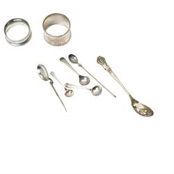 Two silver napkin rings, silver mirror frame and various silver spoons