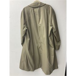 Ladies Burberry double breasted trench coat, with belt and detachable woollen gilet, in traditional cream colour with Burberry check lining, together with a gentlemans Burberry single breasted trench coat, both L112cm