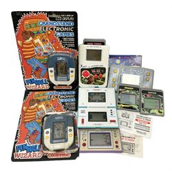 Collection of retro handheld games, including Nintendo Game & Watch ‘Snoopy Tennis’ (1982) and ‘Squish’ (1986) both with instruction booklets, Casio CG-600 ‘Star Invader’ with box, 3 in 1 LCD cartridge game including ‘Soccer’, ‘Invader’ and ‘Bomb Finder’ games, and two Grandstand ‘Pinball Wizard’ (1988) games, both with original boxes