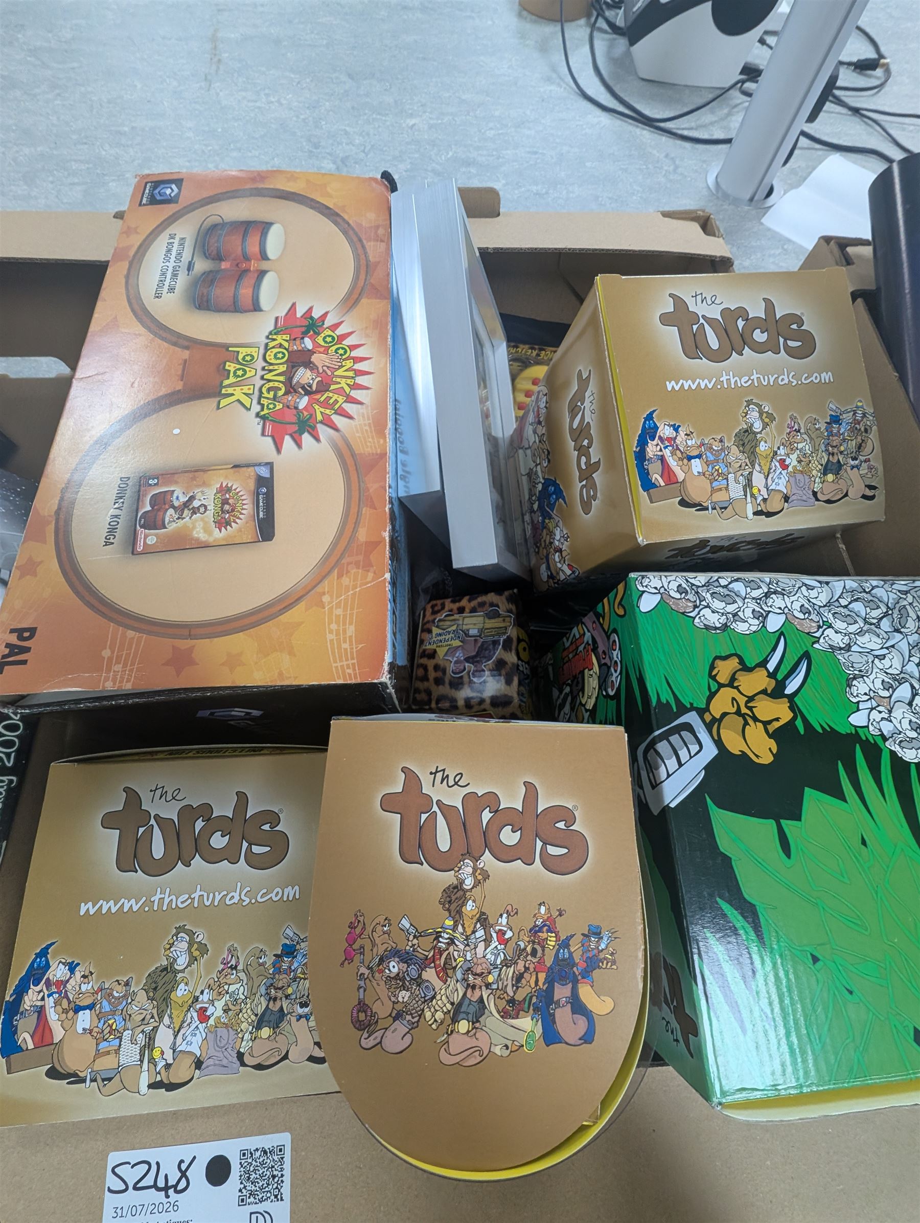 Toys and collectables, including Star Wars reference books, Nintendo Gamecube Donkey Konga Bongos, signed limited edition Doctor Who calendar, four The Turds figures, Tardis plastic storage box, etc