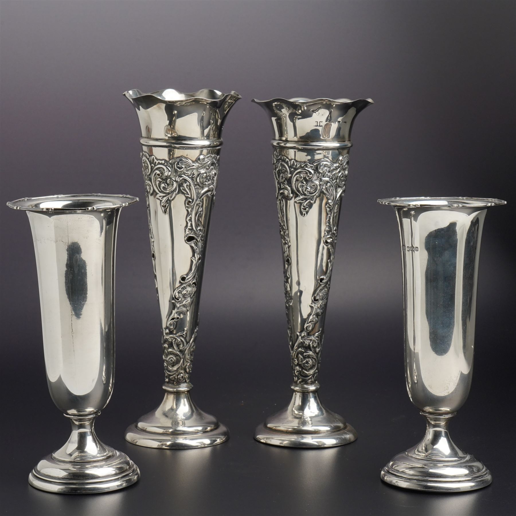 Pair of embossed silver trumpet shape vases H21cms marks rubbed but maker Henry Matthews and another pair of plain vases H15cm Sheffield 1913 Maker Lee & Wigfull
