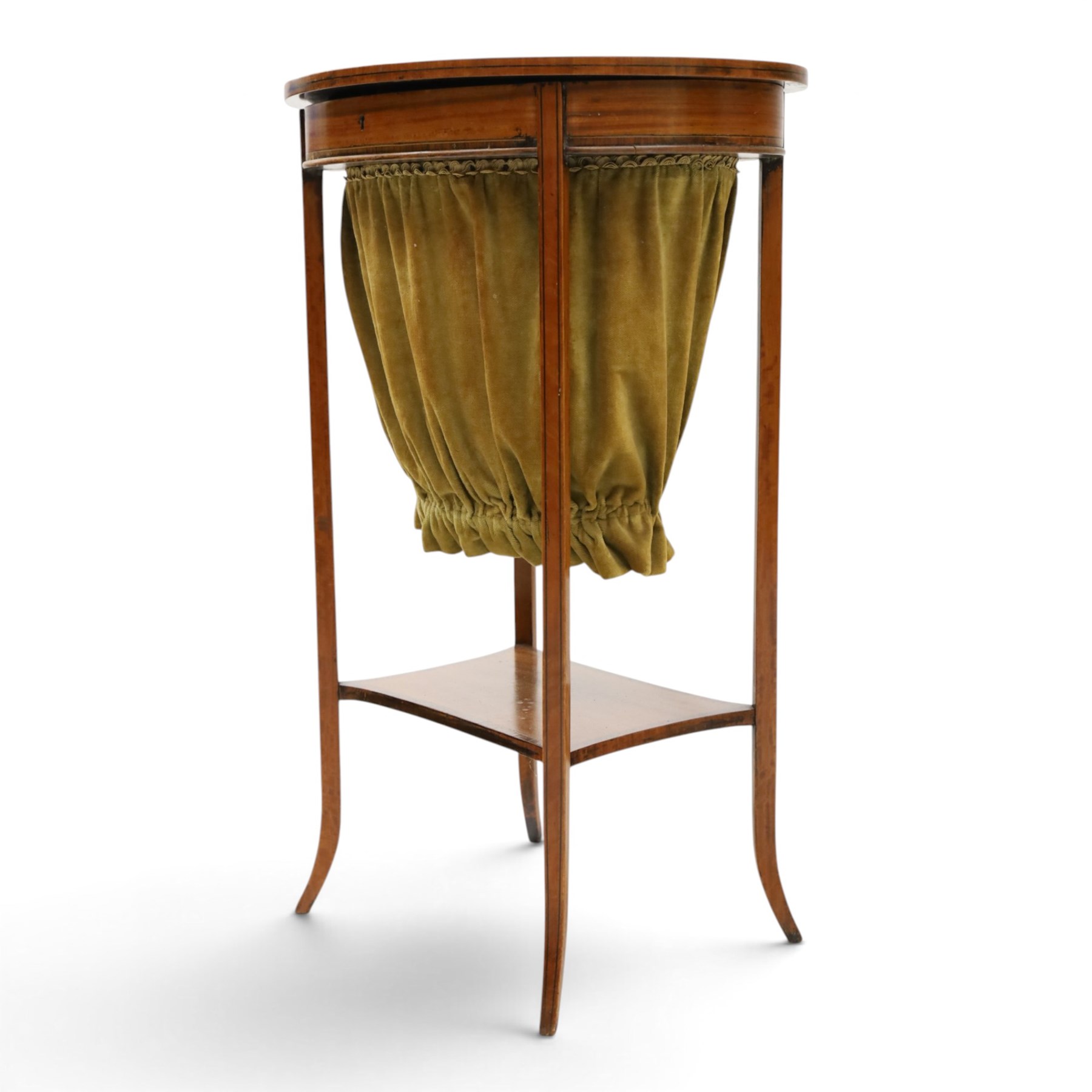 Edwardian inlaid satinwood oval sewing or work table, crossbanded and ebony-strung hinged top enclosing fitted compartment and olive-green upholstered well, raised on square tapering splayed supports united by under-tier 
