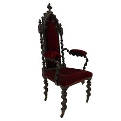 Victorian oak and wrought metal Gothic open armchair, the pointed arched back carved with foliate, cusped inner arch upholstered in red, spiral turned uprights and supports, with arms made of spiral forged metal