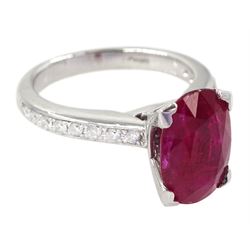18ct white gold ruby and diamond ring, single oval cut ruby of approx 2.75 carat, with channel set diamond shoulders, hallmarked