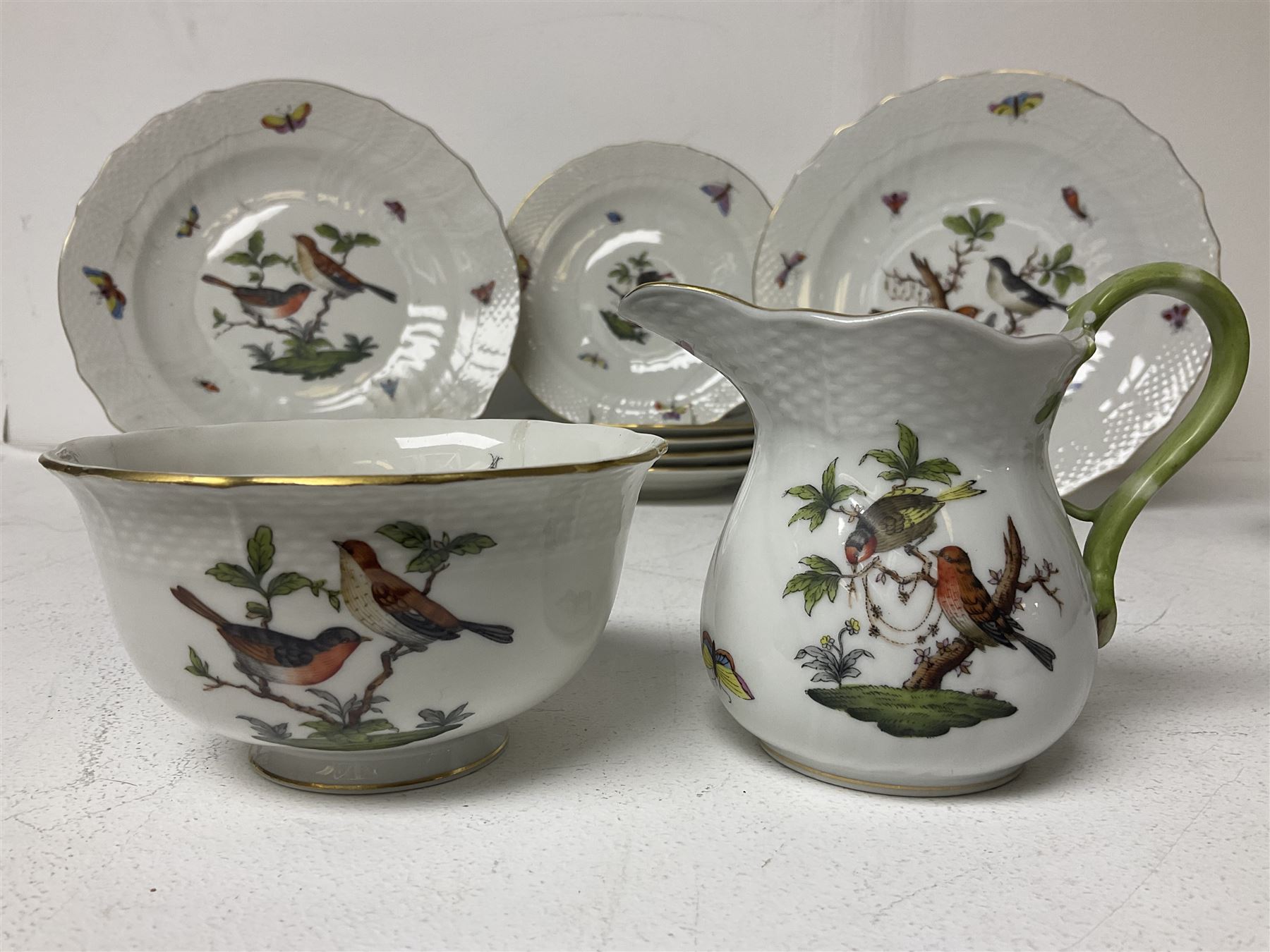 Herend of Hungary Rothschild bird pattern, part tea service, comprising two large teacups and saucers, two teacups and three saucers, milk jug, sugar bowl, five dessert plates and two side plates (18)