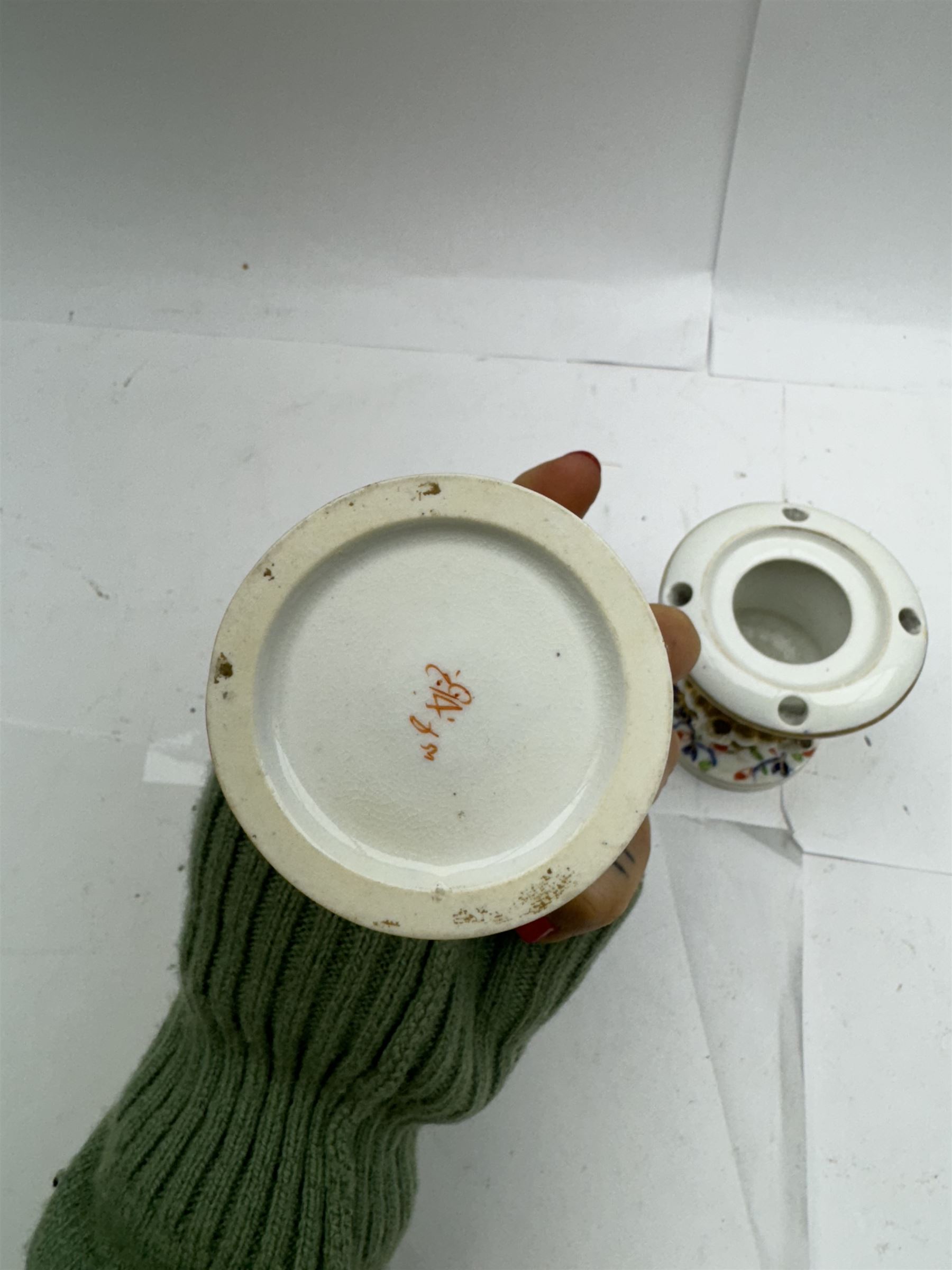 Pair of Staffordshire figures modelled as chained Dalmatians seated upon cobalt blue oval bases, H13cm, together with a Staffordshire pastille burner modelled as a castle, H12cm, a pair of 19th century Derby potpourri pots (lacking covers), and an 18th century blue and white tea bowl 