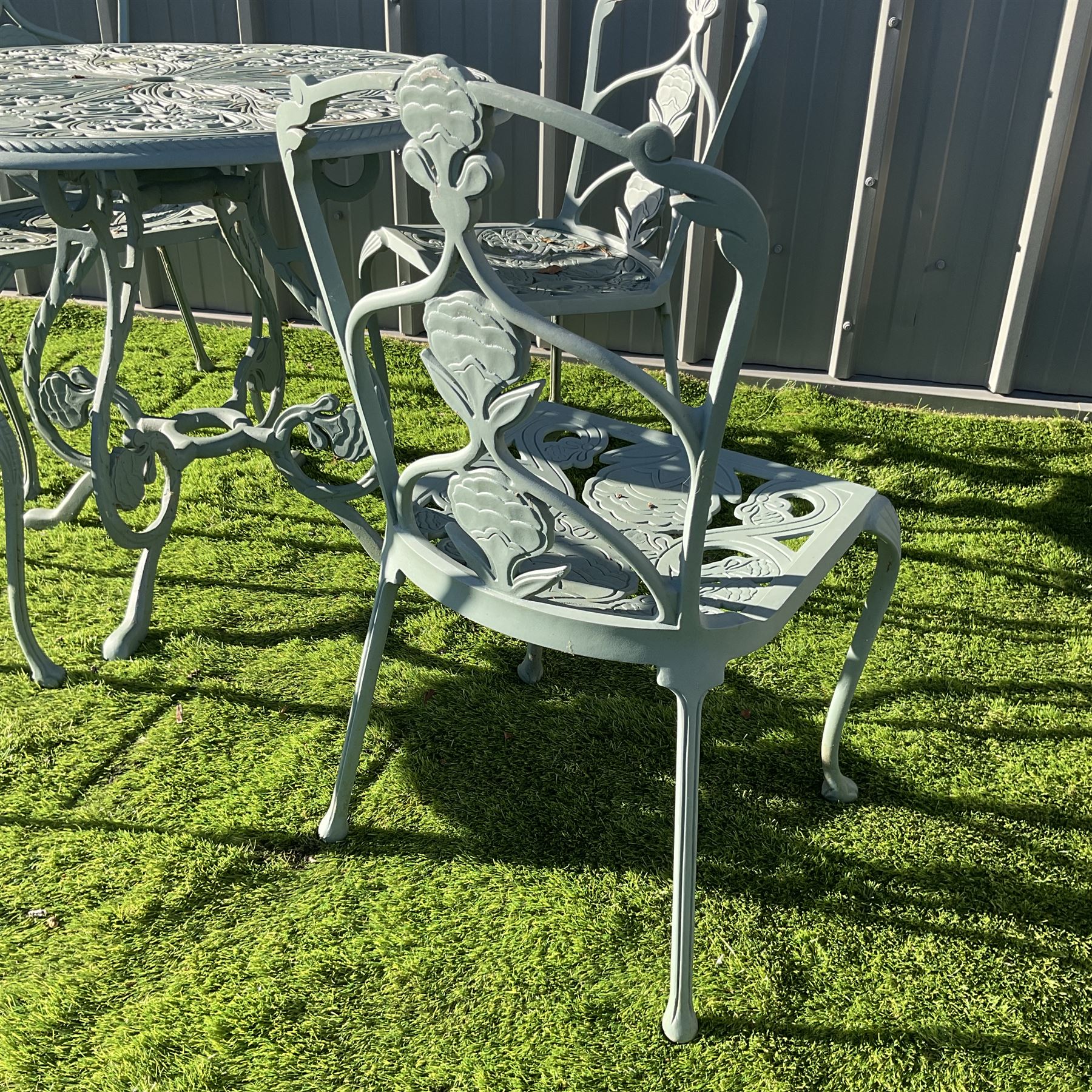 Painted cast aluminium circular garden table, and four chairs - THIS LOT IS TO BE COLLECTED BY APPOINTMENT FROM DUGGLEBY STORAGE, GREAT HILL, EASTFIELD, SCARBOROUGH, YO11 3TX