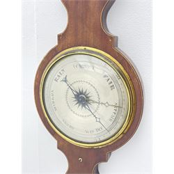 Early 19th century mahogany banjo barometer, scroll pediment over dry/damp and thermometer dials with brass registers, by ‘Crowden & Garrod, London’ (H107cm), and an early 20th century walnut and satinwood banded barometer by ‘Aitchison, London’ (H96cm)