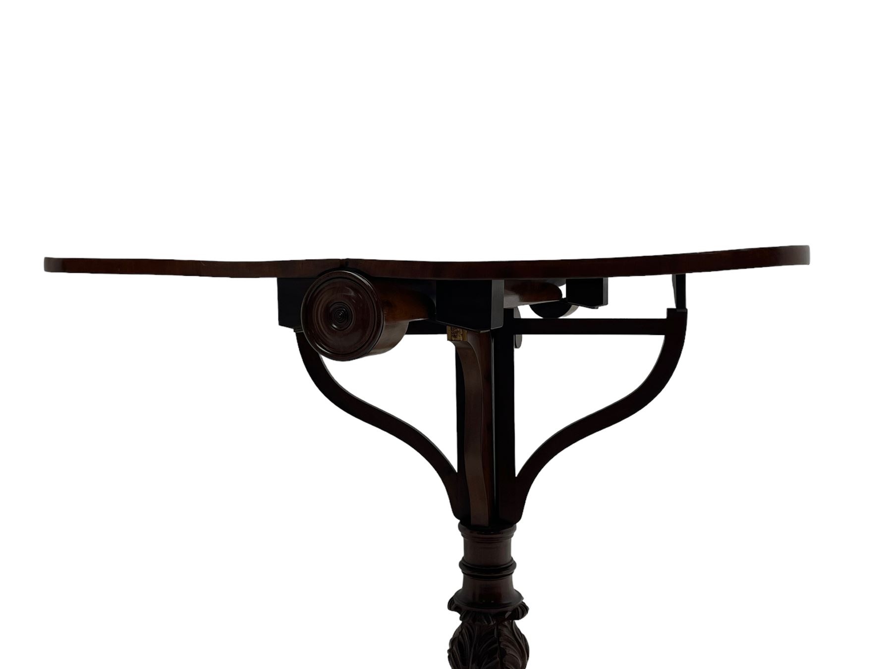 Unusual William IV mahogany Sutherland table, figured and book-matched rectangular drop-leaf top on cylindrical barrel movement, turned roundels to each end, on turned pedestal with acanthus carved baluster, shaped platform with four extended paw feet