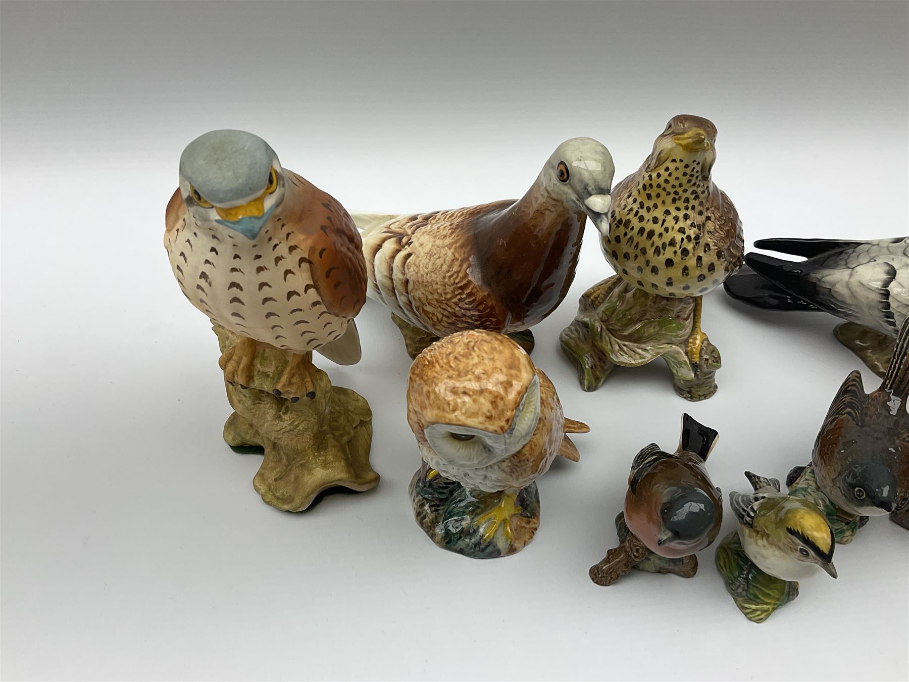 Collection of Beswick figures, to include wren model no 993, Greenfinch model no 2105, Robin model no 980, whitethroat model no 2106, stonechat model no 2274, chaffinch no 991, magpie model no 2305, etc.