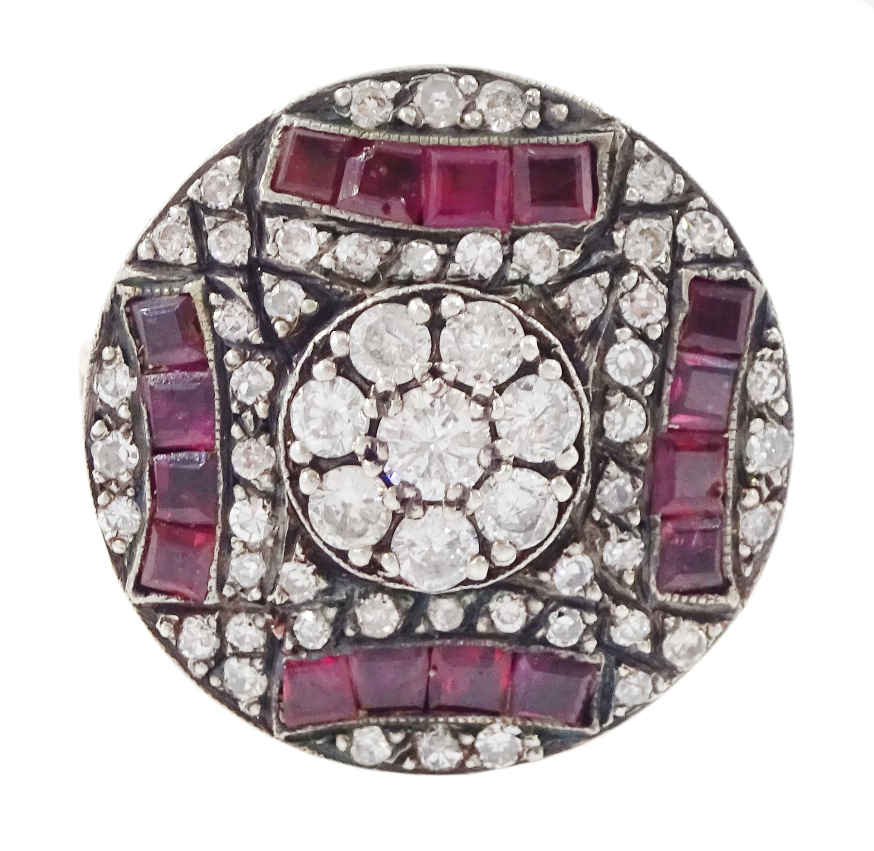 Rose gold and silver ruby and diamond circular ring, the central cluster set with eight round brilliant cut diamonds, with calibre cut ruby and single cut diamond surround, total diamond weight approx 0.90 carat, total ruby weight approx 0.75 carat