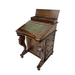 Victorian design mahogany Davenport desk, sloped top with raised hinged compartment, fitted with eight drawers, serpentine front supports carved with flower heads