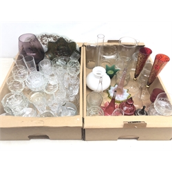  Victorian and later glass trumpet flutes and a pair of silver-plated stands, pair Theresienthal ruby coloured glass flutes, collection of glass oil lamp shades and funnels, Carnival glass bowl, cut and moulded drinking glasses and other glassware in two boxes  