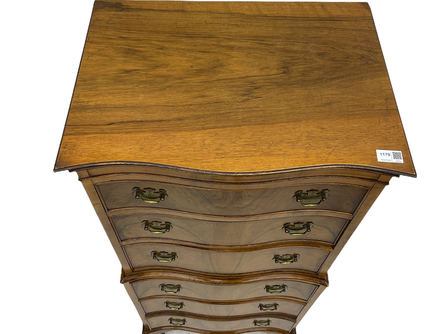 Burton Reproductions walnut chest on chest, fitted with six serpentine drawers
