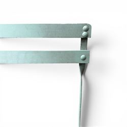 Wrought metal folding garden table, with painted wood plank top; and four matching folding chairs