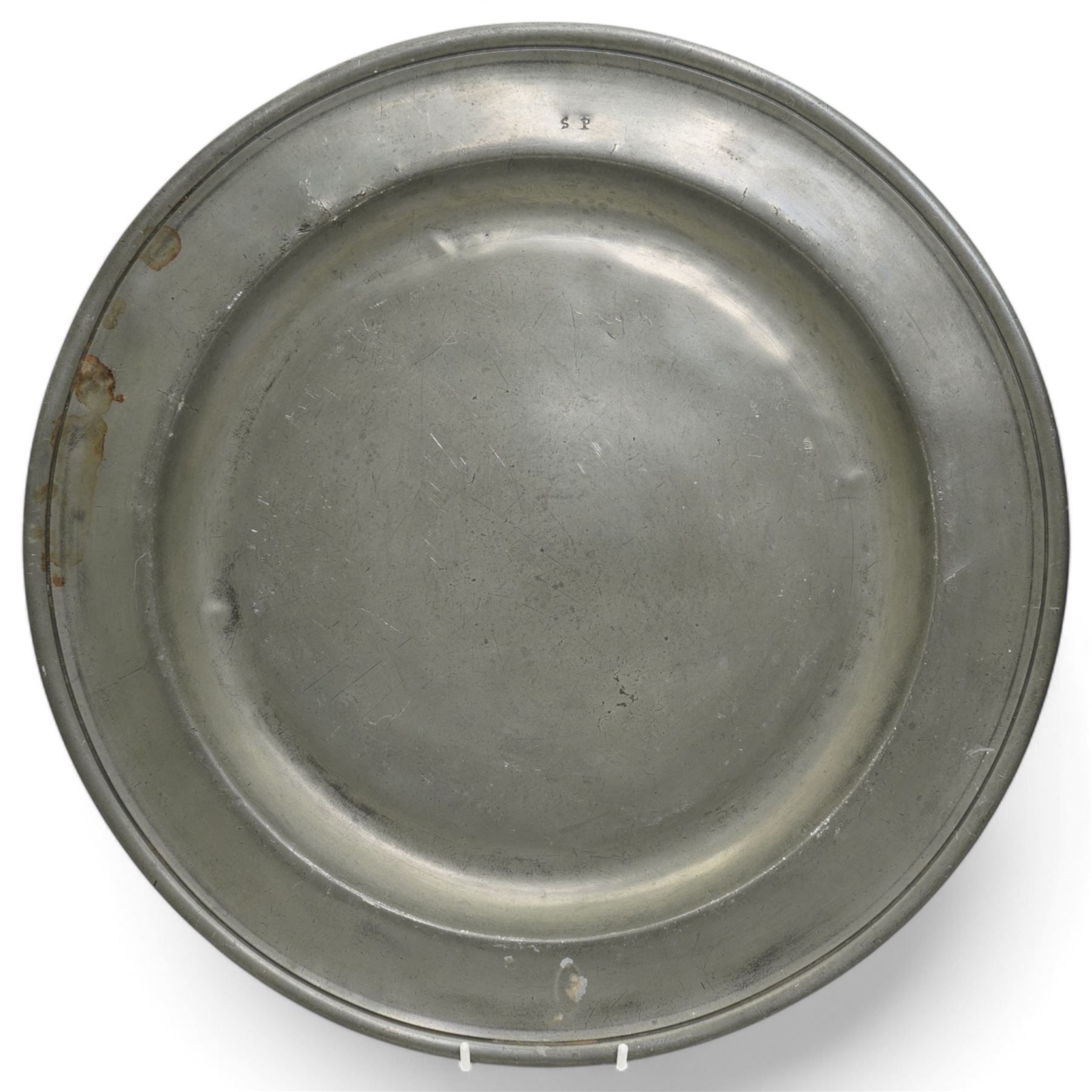Collection of early 19th century and later British pewter, mostly London label marks, including two large pewter chargers, medicine spoon, flasks, plates and other tableware