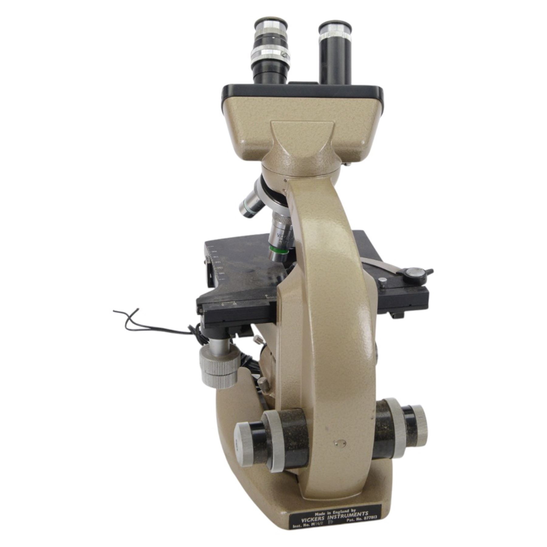 Three microscopes, including Griffin Student Vernier Microscope, Vickers Instruments binocular microscope with Leitz Wetzlar Periplan 10x lenses, and a Carl Zeiss Jena binocular microscope in a wooden Olympus Tokyo box