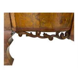 Mid-20th century walnut single bedstead, high shaped headboard, footboard with turned finials and scrollwork carvings, complete with 'Vono' iron frame, raised on cabriole supports