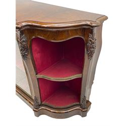 19th century rosewood buffet credenza, bombe form with shaped and moulded top, two central glazed doors with foliate moulded gilt slips, the red fabric-lined interior fitted with a single shelf, flanked by open shelves with raised gilt metal lips, the uprights decorated with shell and flower head carved cartouche mounts, acanthus leaf scroll carved lower mounts, on shaped and moulded plinth base 