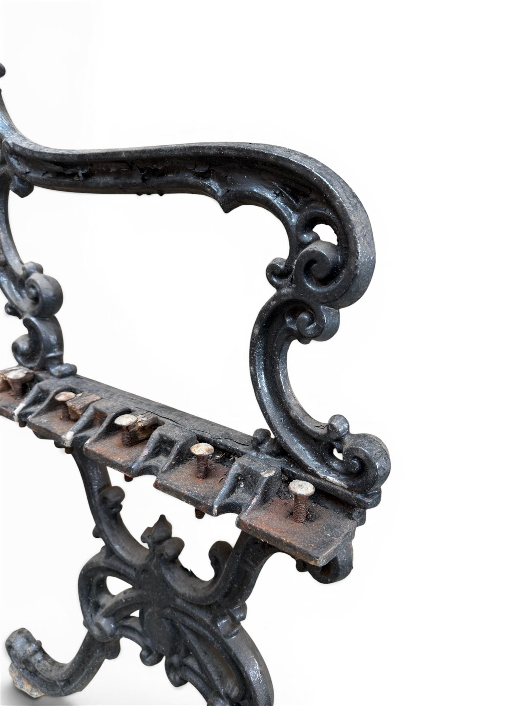 Carron Foundry - two pairs of 19th century cast iron garden bench ends, ornate detail with arms and X shaped legs,finish in black paint, the design no. 110396, first registered 13 July 1857 (see illustration), width as desired