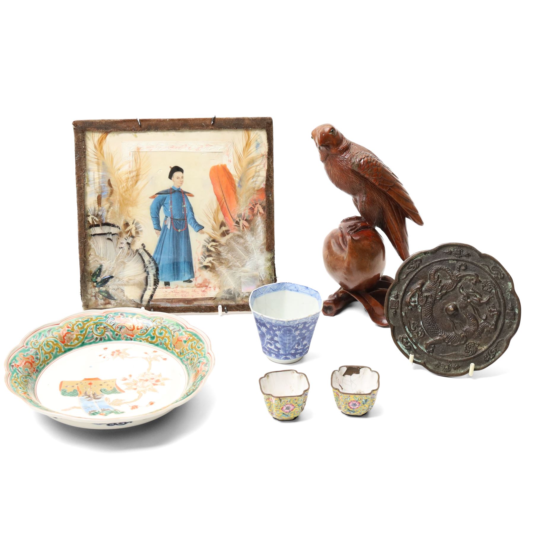 Chinese watercolour on rice paper, within a feathered surround 18cm x 19cm Asian bronze mirror, with dragon decoration D12cm Japanese dish, carved wooden bird and other items