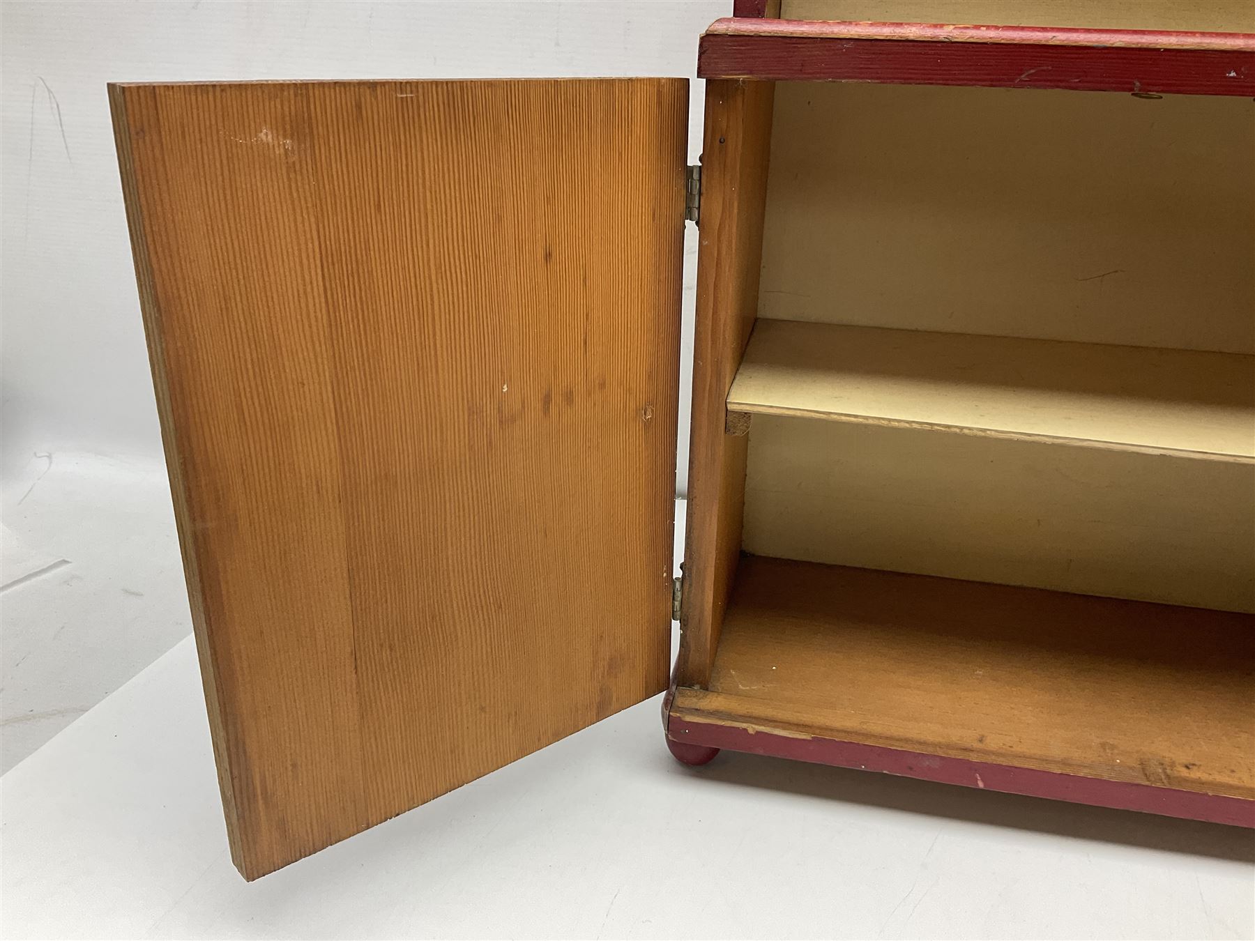 Miniature pitch pine Welsh dresser with open plate rack over two cupboard doors, displayed with Ridgways Humphrey's Clock pattern and other doll's blue/white tea ware, copper kettles and pan etc W41cm H72cm