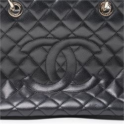 Chanel - black GST Grand Shopping Tote, caviar leather with classic diamond quilting and large embroidered CC logo to the centre front, with polished silver-tone hardware, a rear patch pocket, chain and leather handles, and an open top with three main interior compartments, 2009-2010, serial number 13547470