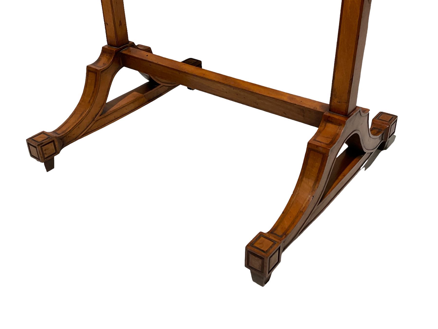 Late George III satinwood fire screen, upholstered in floral blue fabric, fold-down lipped tray with central figured walnut oval inlay, on splayed supports joined by stretchers 