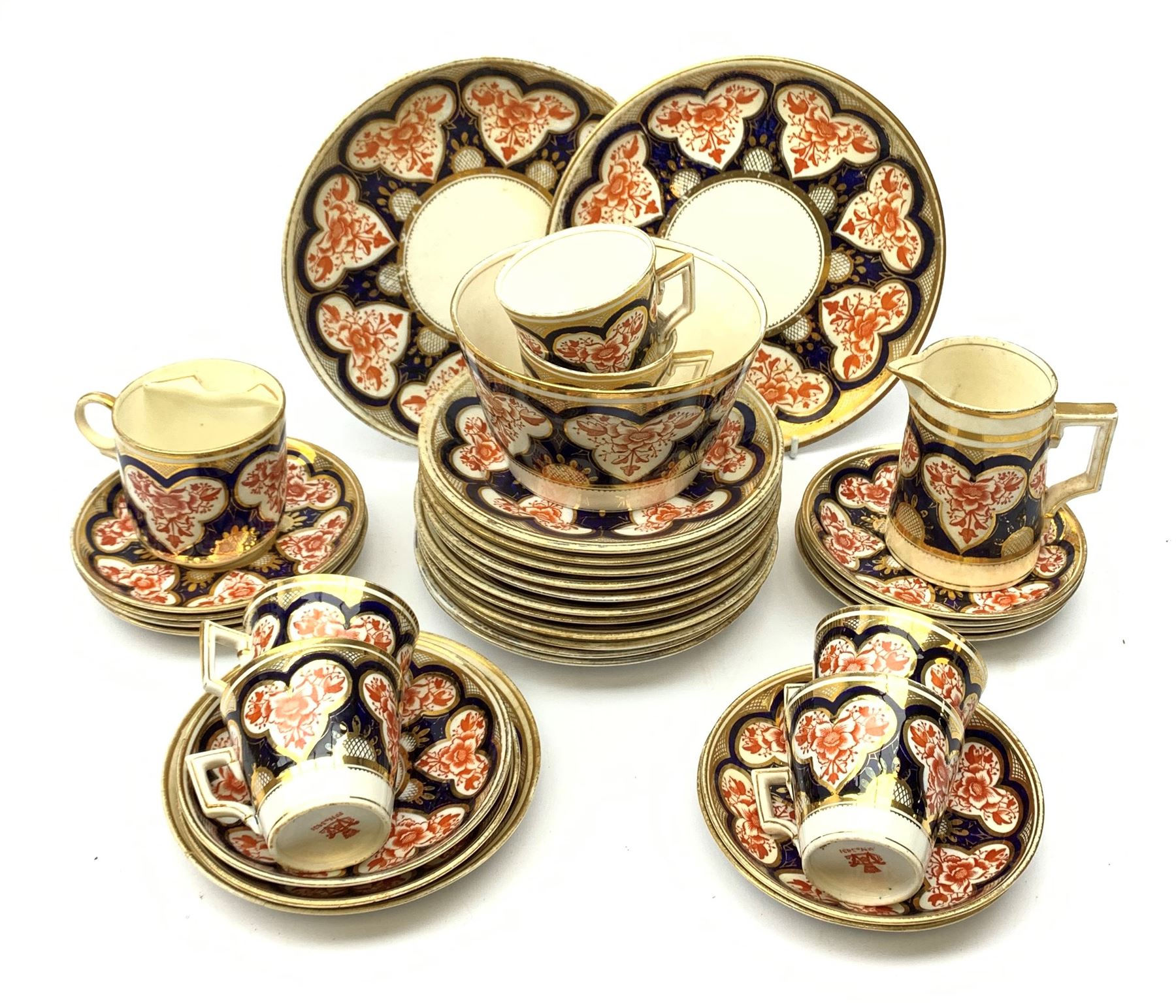 Wileman & Co (Foley) teawares, in the 'Japan' Imari pattern, no 3464, comprising six coffee cans and twelve saucers, eleven side plates, one moustache cup and one saucer, two cake plates, milk jug, and slop bowl. 
