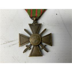 Five continental medals - WW1 Belgian Cross of Fire; WW1 French Croix De Guerre; French Croix De Combattant; French Republic Workers silver merit awarded to L. Mounet 1950; and boxed French Palmes Universitaires Officier d'Academie silver and enamel wreath (5)