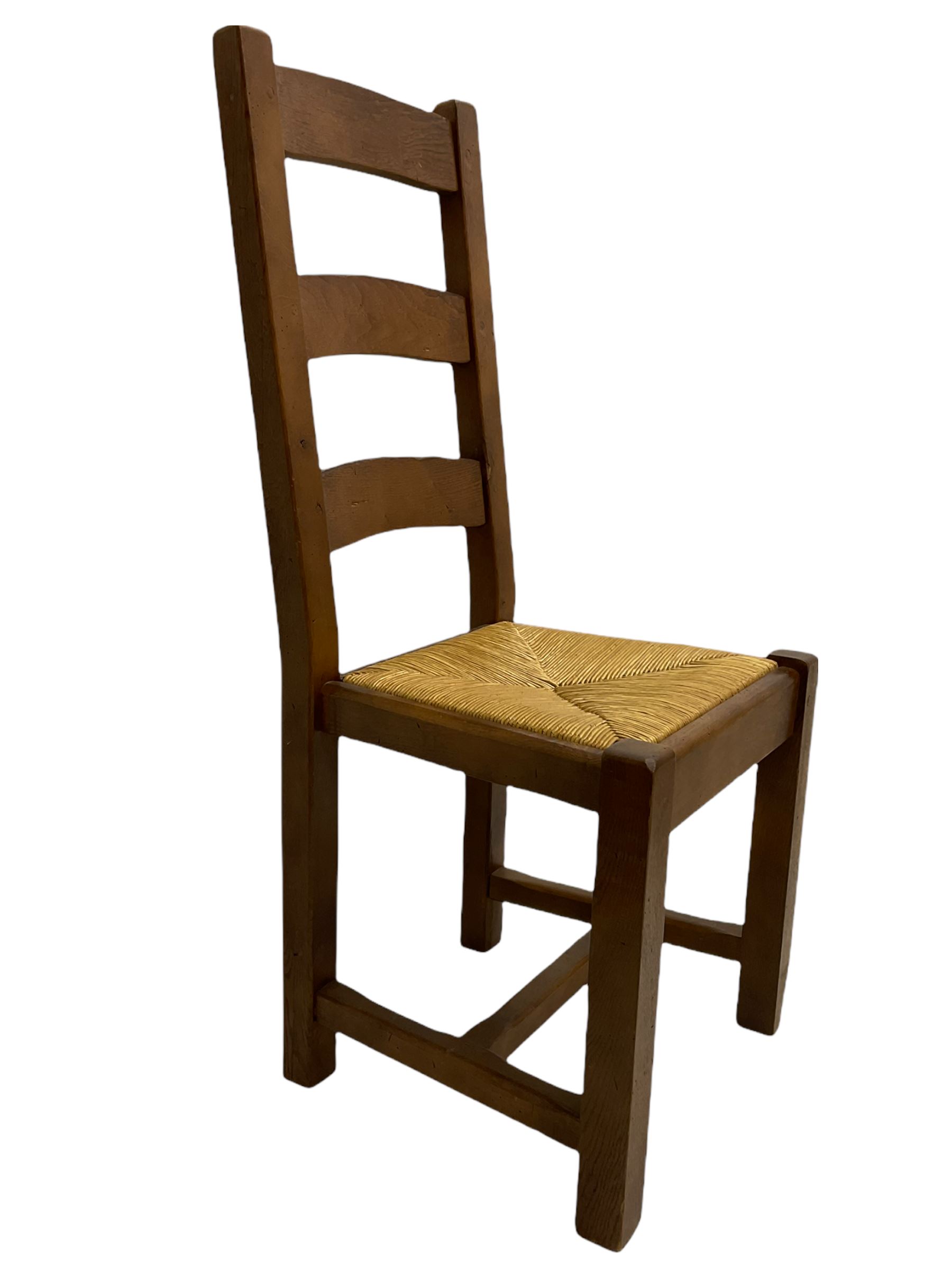 Antix French oak dining table with two leaves, two frieze drawers;, and six ladder back chairs with rush seats