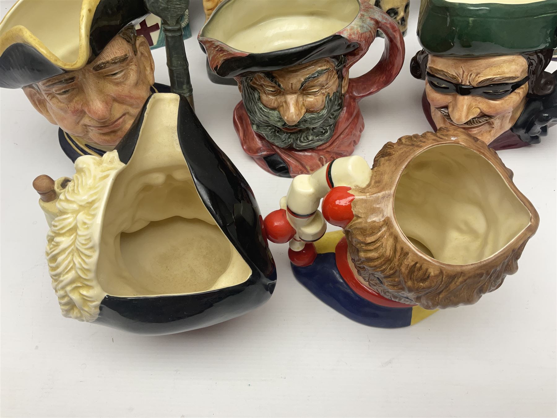 Eight Royal Doulton character jugs, including St George D6618, Guardsman D6568, The Juggler D6835 etc, together with Royal Doulton toby jug Sir Francis Drake D6660