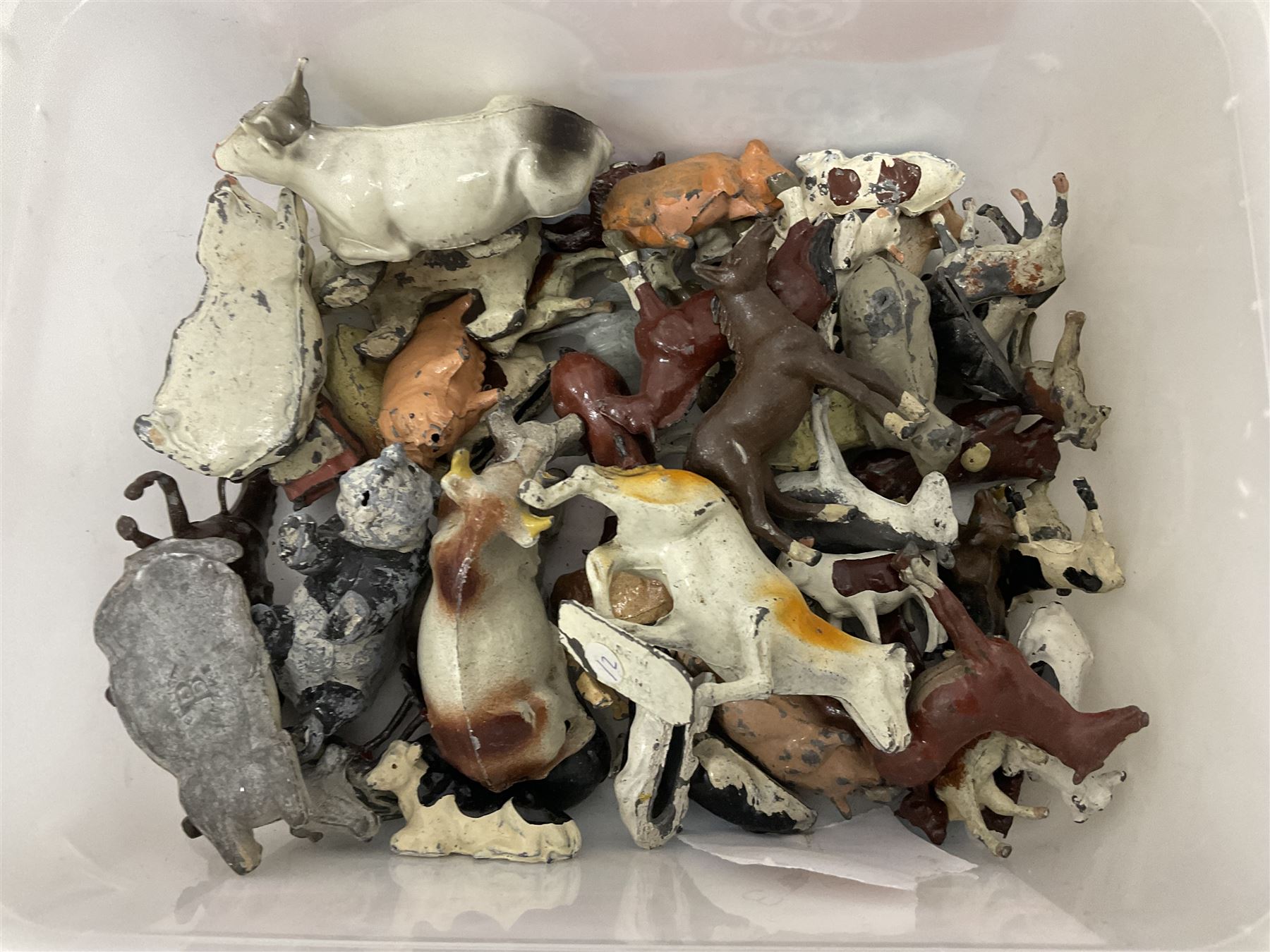 Large quantity of playworn 1950s Britains and other lead figures including farm and zoo animals, horse drawn carts, fencing etc