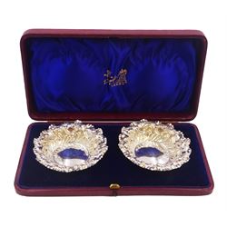 Pair of Victorian silver bon bon dishes, each of circular form, with shaped rim and repousse scroll decoration, hallmarked Fenton Brothers Ltd, Sheffield 1897, in tooled leather velvet and silk lined fitted case