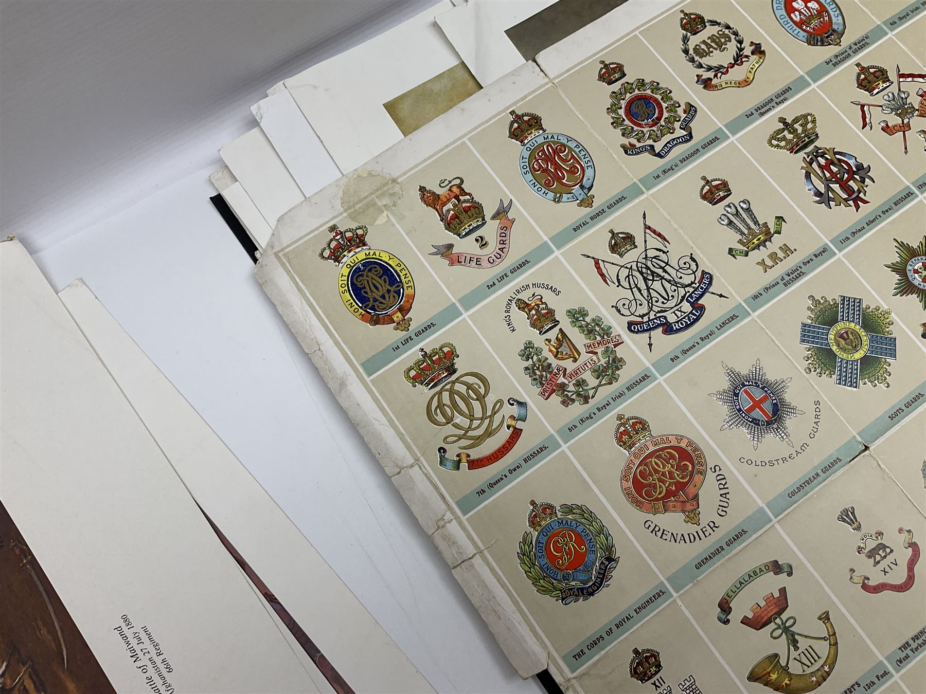 Large poster entitled 'Crests and Badges of the British Army in Daily Use 56 x 86cm; together with twenty-five colour prints of military interest including Crimean War, Boer War, WW2 etc; various sizes; all unframed