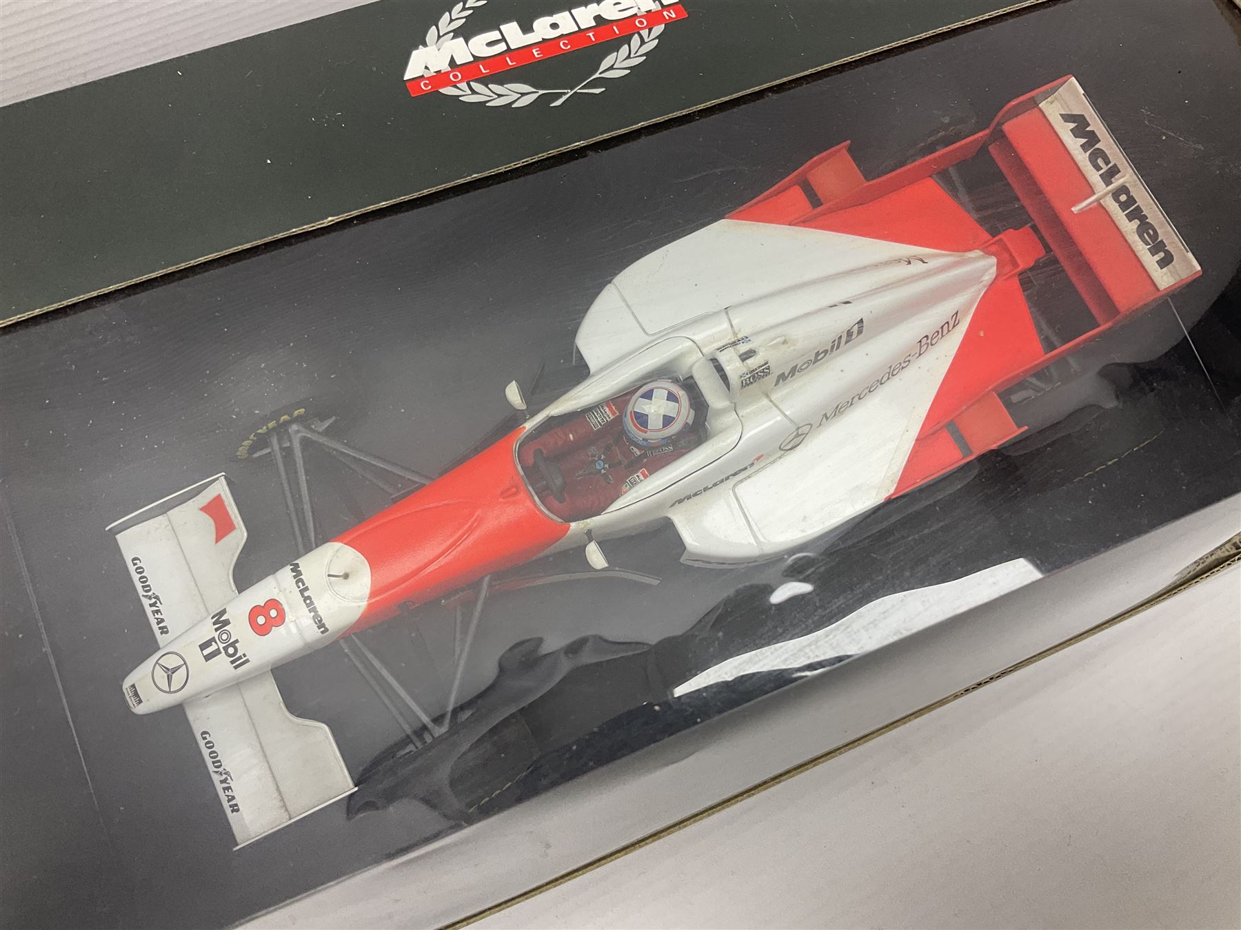 Three Paul's Model Art 1:18 scale die-cast McLaren racing cars - Mercedes MP4/11 D. Coulthard; MP4/4 A. Prost; and Mercedes MP4/10 M. Hakkinen; all boxed (3)