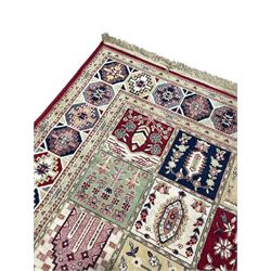 Bakhtiari design rug, the field divided into panels each decorated with tree of life and floral motifs, the main border decorated with Hac motifs 