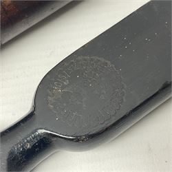 Two late 19th century fruit picker canes, the first example a French ebonised bamboo cane, with pair of fruit scissors to base, the handle stamped Cueille Fruit, the second example with grabbing action, the cap stamped A C Harris, Leicester, together with two other 19th century canes, one with fork and the other with hoe