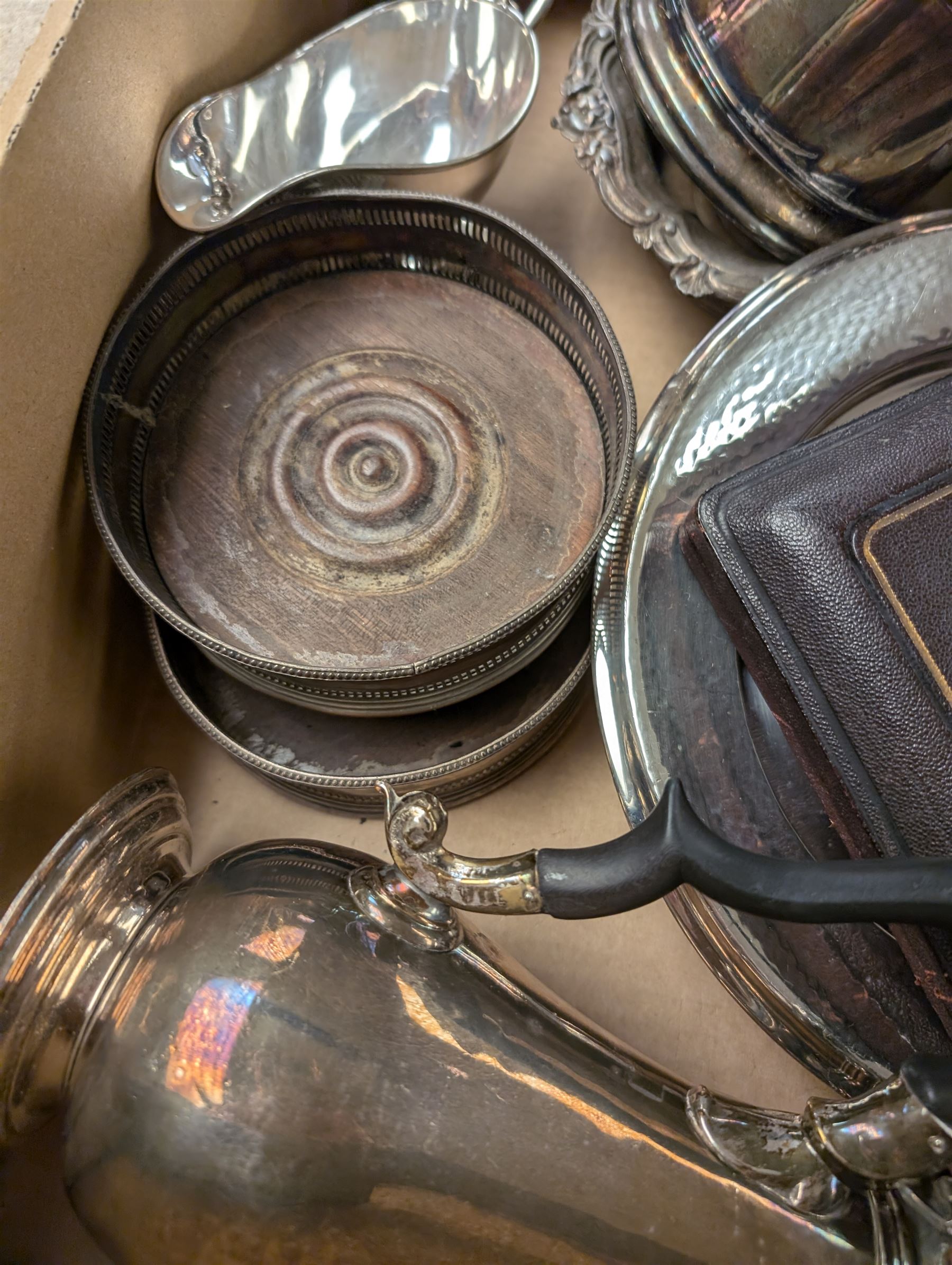 Silver plated items, including coffee pot with bone finial, set of six cased teaspoons and sugar tongs, twin handled cup, tankards, bottle coasters and sauce boat, together with pewter tankard and other metal ware