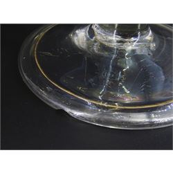 Two 18th century drinking glasses, the drawn trumpet bowls upon stems with internal tears, one elongated, and folded conical feet, largest H18cm